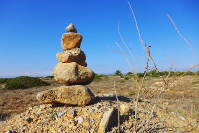 Close-up of cross against clear sky