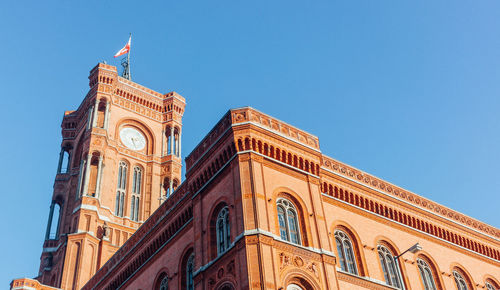 Low angle view of building against clear blue sky