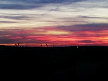 Silhouette of landscape against dramatic sky