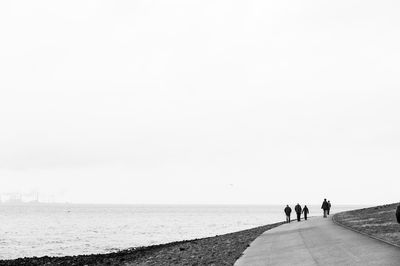 People walking on beach