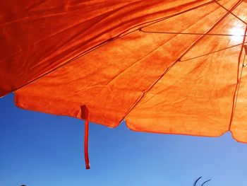 Low angle view of flag against sky