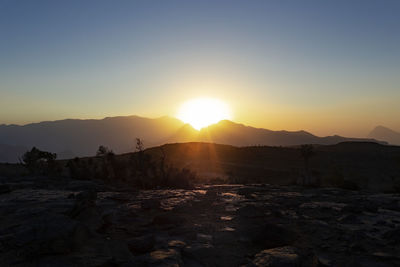 Scenic view of landscape against sky during sunset