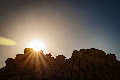 Low angle view of rock formation against clear sky