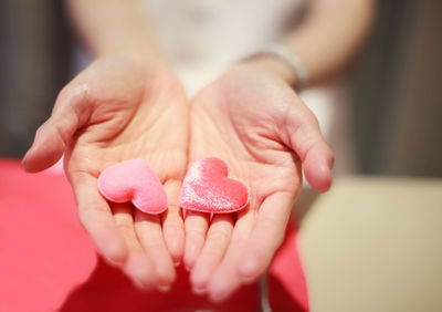 Close-up of hand holding heart shape