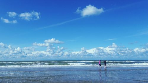 Man on beach against sky