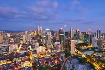 High angle view of illuminated buildings in city against sky