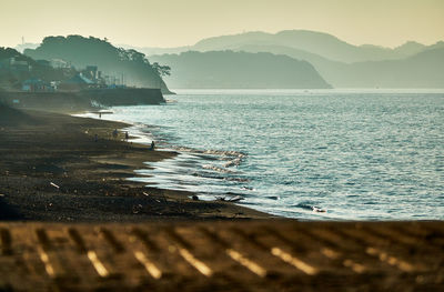 Scenic view of sea against mountains