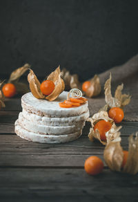 Close-up of physalis and waffles on table