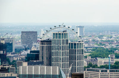 Modern buildings in city against sky