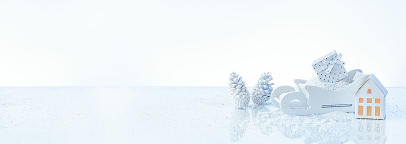 Snow covered land against clear sky