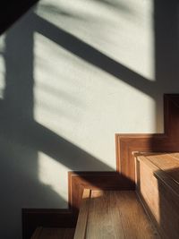 Shadow of staircase on wall of house