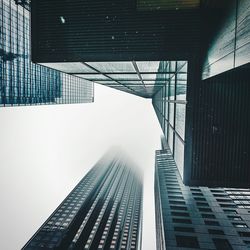 Directly below shot of modern buildings against sky