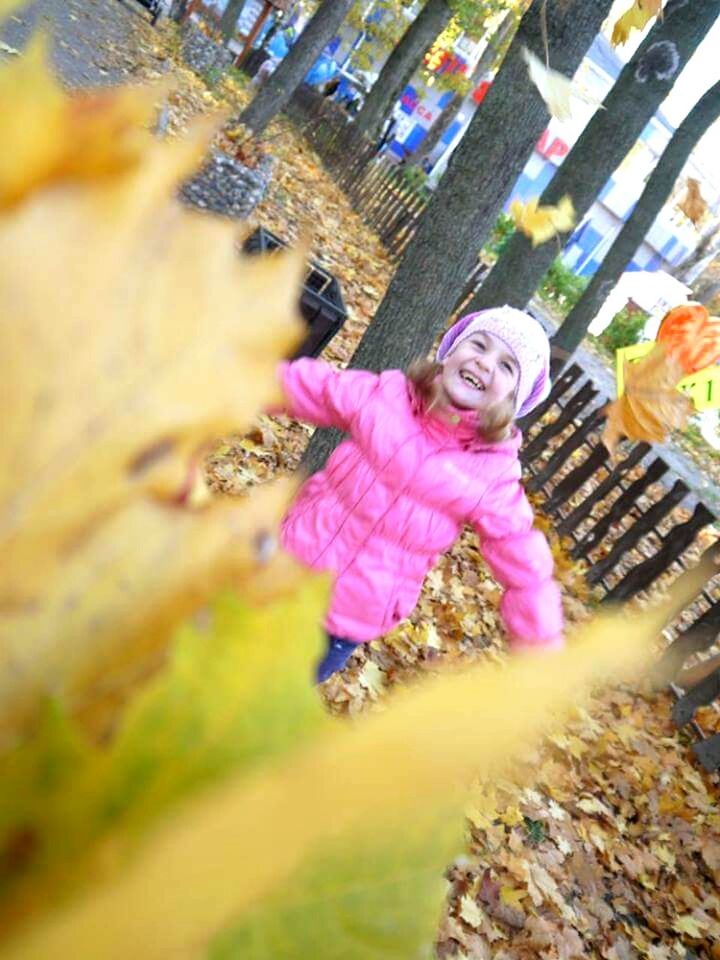 one person, childhood, one girl only, full length, child, girls, pink color, outdoors, smiling, fun, happiness, multi colored, cheerful, people, portrait, playing, real people, day, adult