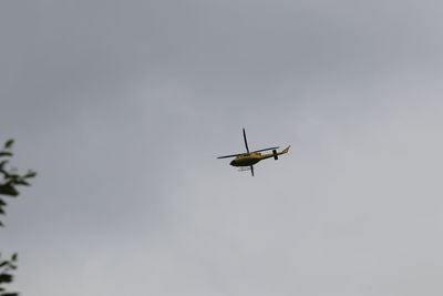 Low angle view of airplane against clear sky