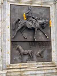 Statue against building