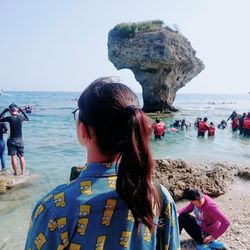 Rear view of people on beach