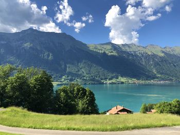 Scenic view of lake and mountains against sky