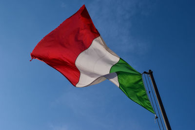 Low angle view of italian flag against sky