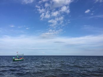 Boat in sea against sky