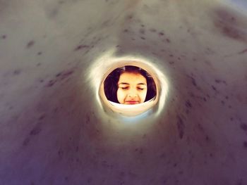 High angle portrait of girl in hole