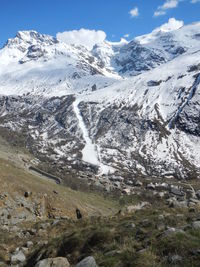 Scenic view of snow covered mountains