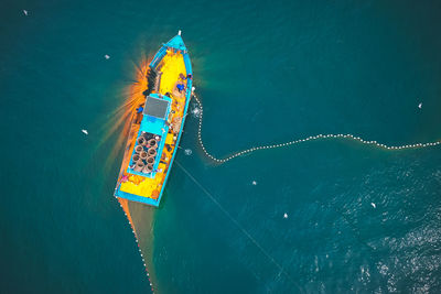 High angle view of ferris wheel in sea