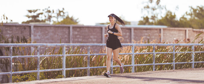 Full length of woman on railing