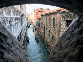 High angle view of people on gondolas sailing in canal