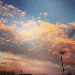 Low angle view of cloudy sky at sunset