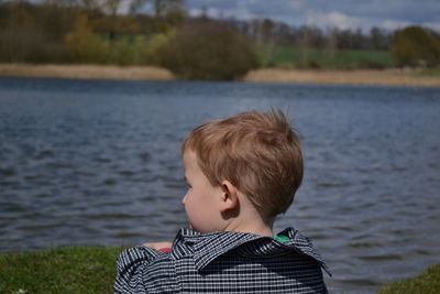 Close-up of boy standing in lake