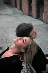 High angle view of couple relaxing on street