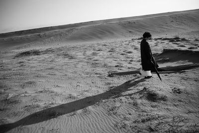 Full length of man walking on beach