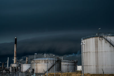 Storm clouds over crossbridge energy fredericia refinery, denmark