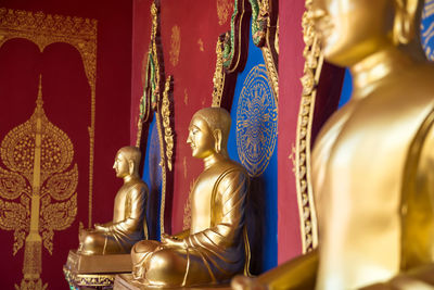 Buddha statue row at wat mahathat, krabi
