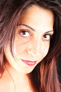 Close-up portrait of smiling young woman