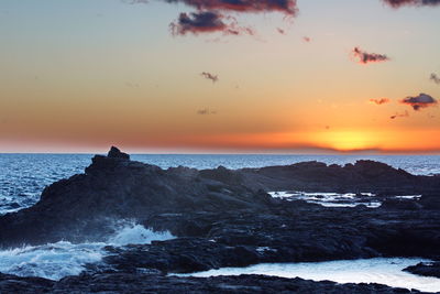 Scenic view of sea against sky during sunset