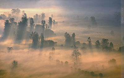 Scenic view of landscape against cloudy sky