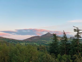 Scenic view of mountains against sky during sunset