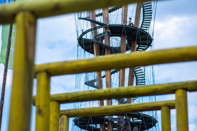 Low angle view of metallic structure against sky