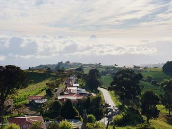 High angle view of trees and buildings against sky