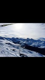 Scenic view of snow covered mountains