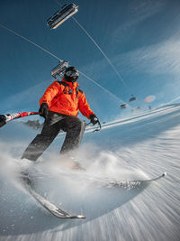 Man skiing on snow covered landscape