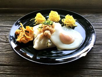 High angle view of vegetables in plate on table