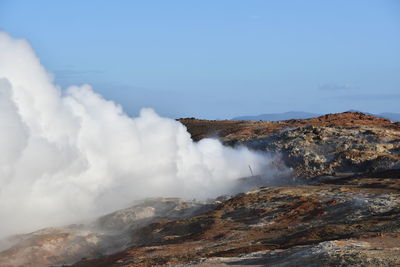 Scenic view of volcanic mountain against sky