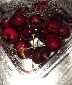 High angle view of strawberries in bowl on table