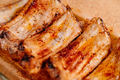 High angle view of meat on barbecue grill