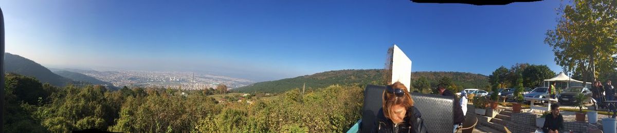 Panoramic view of landscape against clear blue sky