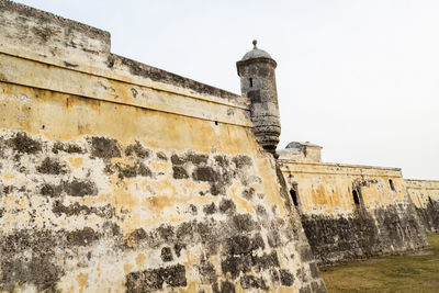 Low angle view of fort against sky