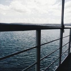 Close-up of railing against sea