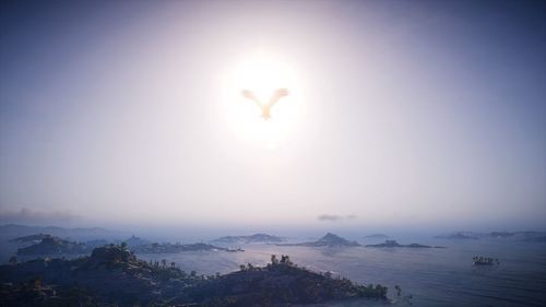 High angle view of sea and mountain against sky